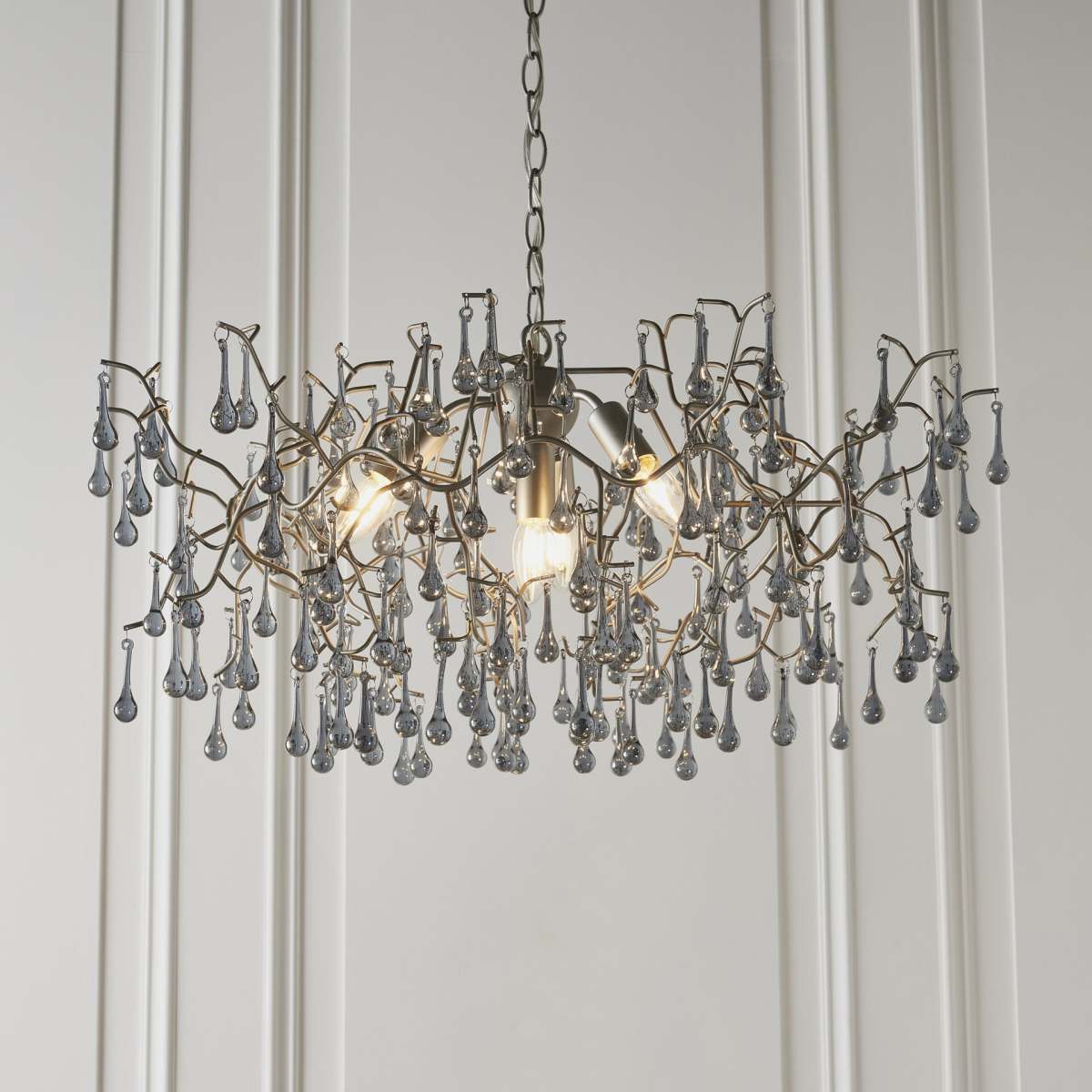 Aged silver branch chandelier with glass droplets